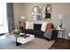 Comfortable living room featuring a sofa, accent pillows, modern coffee table, and stylish decor at 1350 May Avenue # 14, Atlanta, GA 30316
