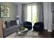 Stylish living room featuring a comfortable sofa, modern seating, and large window with natural light at 1350 May Avenue # 14, Atlanta, GA 30316