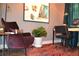 Comfortable office space featuring an inviting arm chair, sleek desk, stylish decor, and vibrant artwork at 1350 May Avenue # 14, Atlanta, GA 30316