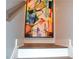 A modern stairway featuring an eye-catching, colorful abstract painting at 1350 May Avenue # 14, Atlanta, GA 30316