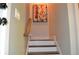 Stairway featuring neutral walls, white risers, wood treads, and a handrail at 1350 May Avenue # 14, Atlanta, GA 30316