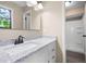 Bathroom with a granite vanity, modern fixtures, and a tiled shower at 2445 Deerfield Nw Dr, Kennesaw, GA 30144