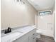 Bathroom featuring a white vanity with granite countertop and a tub/shower combination at 2445 Deerfield Nw Dr, Kennesaw, GA 30144