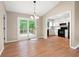 Dining area adjacent to the kitchen, featuring hardwood floors and sliding doors to the outdoor deck at 2445 Deerfield Nw Dr, Kennesaw, GA 30144