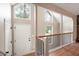 Bright foyer with hardwood floors, high ceilings, and large windows, creating a grand entrance to the home at 2445 Deerfield Nw Dr, Kennesaw, GA 30144