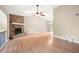 Spacious living room featuring a stone fireplace, vaulted ceilings, and hardwood floors for a cozy ambiance at 2445 Deerfield Nw Dr, Kennesaw, GA 30144