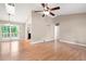Bright living area with hardwood floors, vaulted ceilings, and access to the outdoor patio, ideal for relaxing or entertaining at 2445 Deerfield Nw Dr, Kennesaw, GA 30144