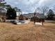 This home has a backyard oasis with a pool and pergola at 325 Northmill Pkwy, Stockbridge, GA 30281