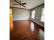 A bright living room features hardwood floors and neutral paint at 325 Northmill Pkwy, Stockbridge, GA 30281