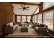Sunroom with hardwood floors, brick wall, ceiling fan, lots of natural light, and comfortable furniture at 325 Northmill Pkwy, Stockbridge, GA 30281