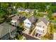 Stunning aerial view of a neighborhood featuring well-maintained homes, lush greenery, and tree-lined streets at 750 Tannery Cmn, Alpharetta, GA 30009