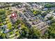 Wide aerial shot of the property's location within a suburban neighborhood, near trees and a pond at 750 Tannery Cmn, Alpharetta, GA 30009