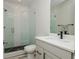 Clean, modern bathroom featuring a glass-enclosed shower, gray vanity, and contemporary finishes at 750 Tannery Cmn, Alpharetta, GA 30009