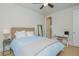 Cozy bedroom featuring a comfortable bed and a desk area, perfect for work or study at 750 Tannery Cmn, Alpharetta, GA 30009