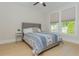 Bright bedroom with large window and neutral colors and wood flooring at 750 Tannery Cmn, Alpharetta, GA 30009