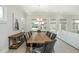 Elegant dining room features a long wooden table, comfortable chairs, and a stylish chandelier at 750 Tannery Cmn, Alpharetta, GA 30009