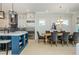 Open concept dining room features a large table with seating for eight and natural lighting at 750 Tannery Cmn, Alpharetta, GA 30009