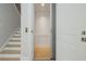 Convenient home elevator with a minimalist design, providing easy access between floors next to stairs at 750 Tannery Cmn, Alpharetta, GA 30009