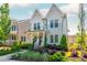 Charming two-story home with a welcoming front porch and professionally landscaped yard at 750 Tannery Cmn, Alpharetta, GA 30009