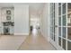 Light filled hallway view of living room and kitchen at 750 Tannery Cmn, Alpharetta, GA 30009
