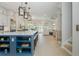 Spacious kitchen featuring stainless steel appliances, a blue island with shelving, and pendant lighting at 750 Tannery Cmn, Alpharetta, GA 30009