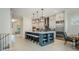 A spacious kitchen features a large island with seating, stainless steel appliances, and pendant lighting at 750 Tannery Cmn, Alpharetta, GA 30009