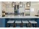 This modern kitchen is stylishly designed with a center island, barstool seating, and upgraded appliances at 750 Tannery Cmn, Alpharetta, GA 30009