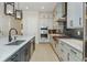 Modern kitchen features stainless steel appliances and an island with counter seating at 750 Tannery Cmn, Alpharetta, GA 30009