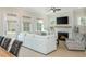 Bright living room with open layout, fireplace, and sliding door to back yard at 750 Tannery Cmn, Alpharetta, GA 30009