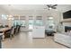 Open-concept living room features a cozy fireplace, sleek ceiling fan, and lots of natural light at 750 Tannery Cmn, Alpharetta, GA 30009