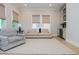 Bright living room featuring stylish furniture, built-in cabinets, and natural light at 750 Tannery Cmn, Alpharetta, GA 30009