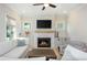 Inviting living room with fireplace, modern decor, and built-in cabinets at 750 Tannery Cmn, Alpharetta, GA 30009