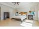 Spacious main bedroom featuring hardwood floors, tray ceiling, and neutral decor for a serene retreat at 750 Tannery Cmn, Alpharetta, GA 30009