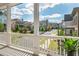 Spacious porch offering neighborhood views, complemented by a serene ambiance and lush green surroundings at 750 Tannery Cmn, Alpharetta, GA 30009