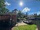 View of the backyard with a brick home and a white pickup truck parked in the driveway at 2059 Clearwater Se Dr, Marietta, GA 30067