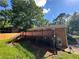Backyard featuring a large red deck and a glimpse of the home at 2059 Clearwater Se Dr, Marietta, GA 30067