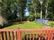 The private backyard features a storage shed and mature trees at 2059 Clearwater Se Dr, Marietta, GA 30067