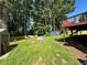 Picturesque backyard featuring a red deck and green grass at 2059 Clearwater Se Dr, Marietta, GA 30067