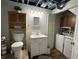 Functional basement bathroom and laundry room with combined fixtures at 2059 Clearwater Se Dr, Marietta, GA 30067