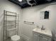 Clean bathroom with a toilet, vanity, and mirror, providing essential amenities at 2059 Clearwater Se Dr, Marietta, GA 30067
