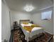 Bright bedroom with a comfortable bed, decorative pillows, and a vintage chair at 2059 Clearwater Se Dr, Marietta, GA 30067
