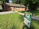 Charming brick home with a well-manicured lawn and inviting walkway leading to the front door at 2059 Clearwater Se Dr, Marietta, GA 30067