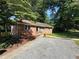 Charming home with well-maintained front yard and gravel driveway at 2059 Clearwater Se Dr, Marietta, GA 30067