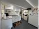 Kitchen includes white appliances, granite counters, and ample storage space at 2059 Clearwater Se Dr, Marietta, GA 30067
