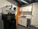 Kitchenette features a microwave, mini fridge, sink, and white cabinets at 2059 Clearwater Se Dr, Marietta, GA 30067