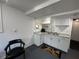 Cozy kitchen features white cabinets, granite countertops, and a stainless steel sink at 2059 Clearwater Se Dr, Marietta, GA 30067