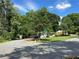 Scenic street view showcasing the charming home and lush greenery in a desirable neighborhood at 2059 Clearwater Se Dr, Marietta, GA 30067