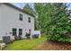 The backyard features a grill, outdoor seating, and lush greenery, perfect for relaxing at 218 Piedmont Cir, Canton, GA 30114