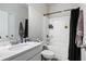 Bathroom with vanity sink and shower-tub combination with black shower curtain at 218 Piedmont Cir, Canton, GA 30114