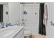 Bathroom with vanity sink and shower-tub combination with black shower curtain at 218 Piedmont Cir, Canton, GA 30114